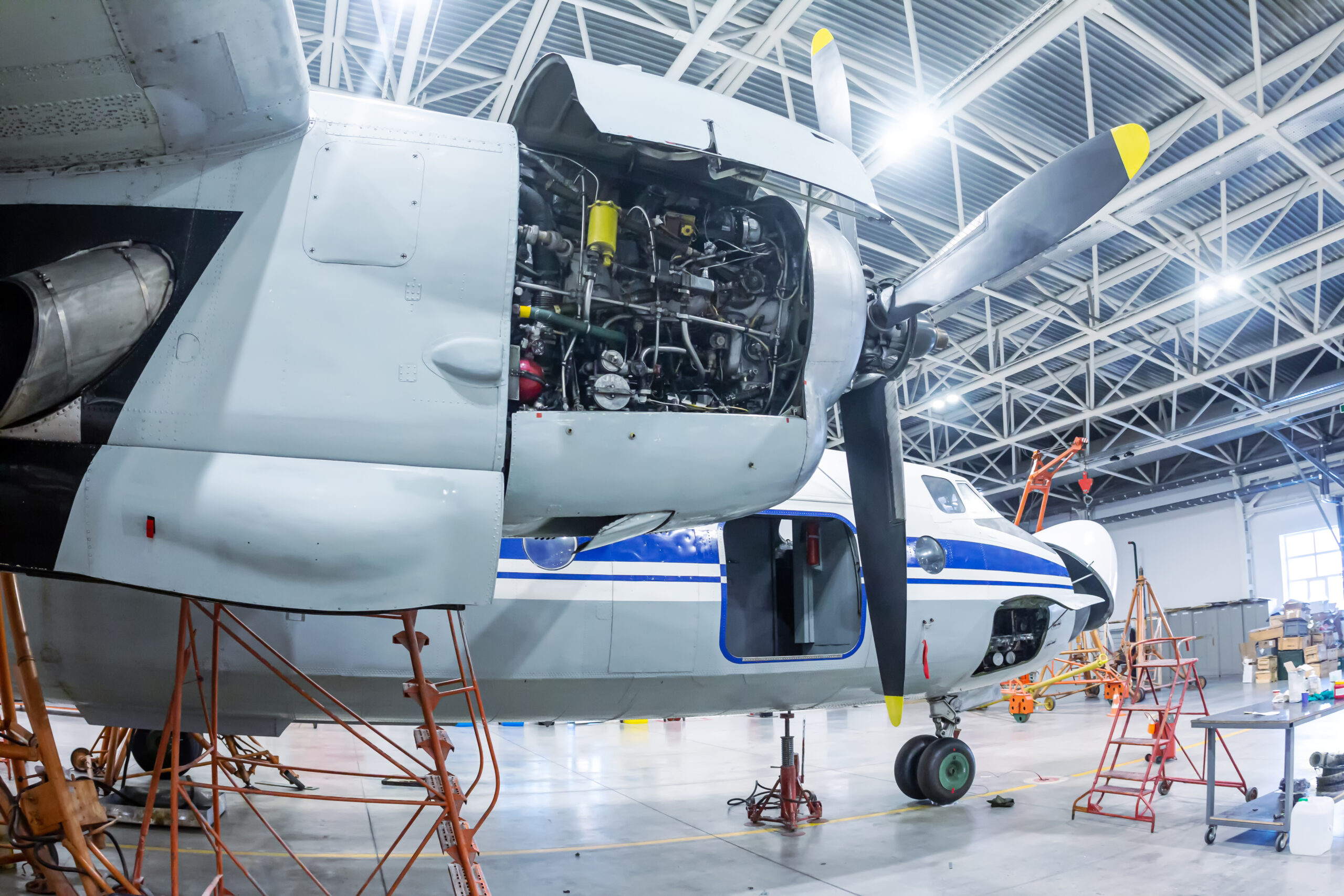 Transport turboprop aircraft in the hangar. Close-up of an open